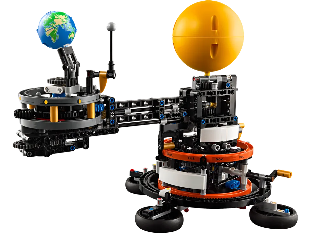 Full view of the LEGO Technic Planet Earth and Moon in Orbit model, showcasing the Sun, Earth, and Moon with visible gearing and Technic beams.