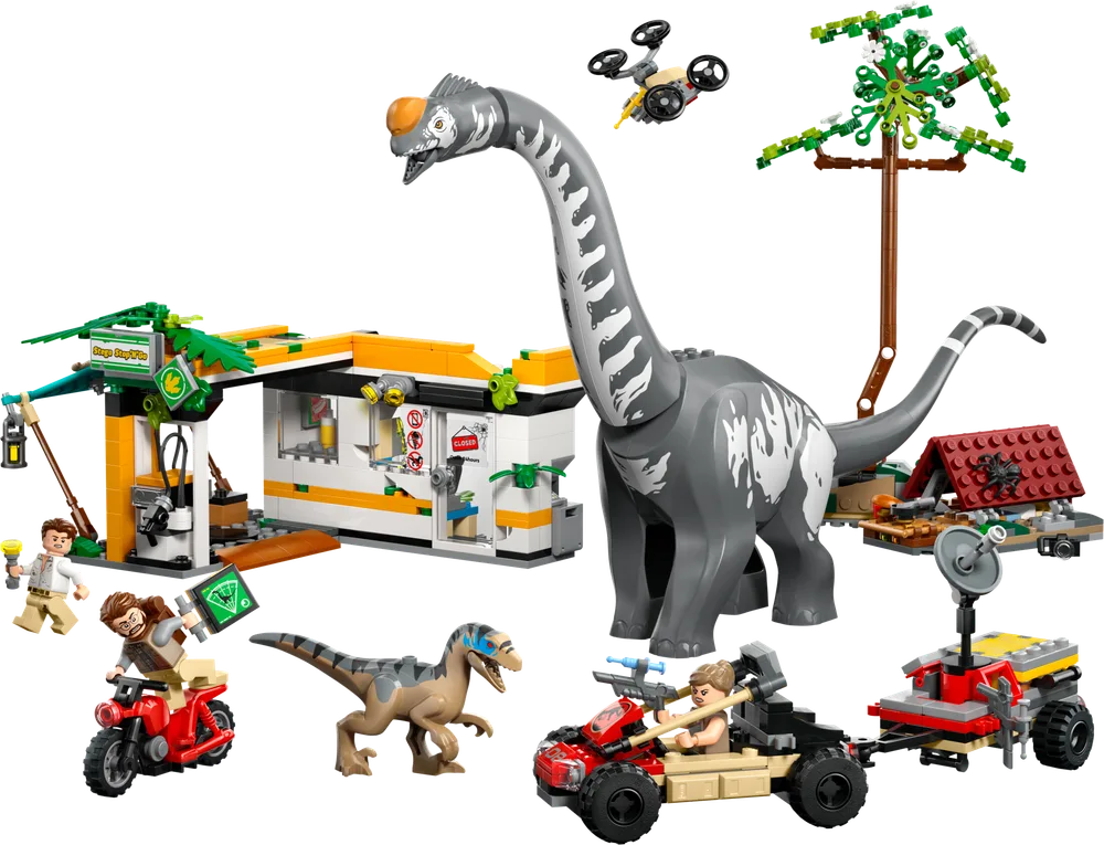 The complete LEGO Jurassic World set 76973 is presented against a white background, featuring a large gray Titanosaurus, a tan raptor, a yellow and green research building, an ATV with a trailer, a motorcycle, a drone, and a tall brick-built tree. Various minifigures are positioned around the set.