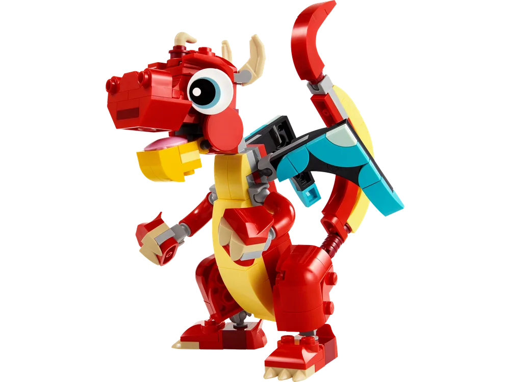 A vibrant red and yellow LEGO Creator 3-in-1 Red Dragon model, standing on a white background, with articulated limbs and wings.