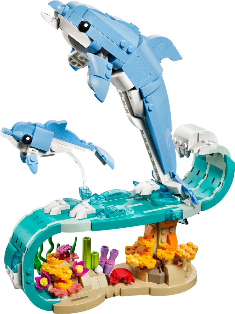 LEGO Creator 31385 Beautiful Dolphins set, showing two light blue dolphins leaping out of a turquoise wave with a colorful coral reef base.