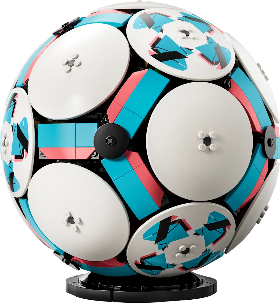 A detailed view of the LEGO 43019 Soccer Ball model, showcasing its intricate SNOT construction, geometric paneling, and vibrant teal, coral, and white color scheme on a black display stand.