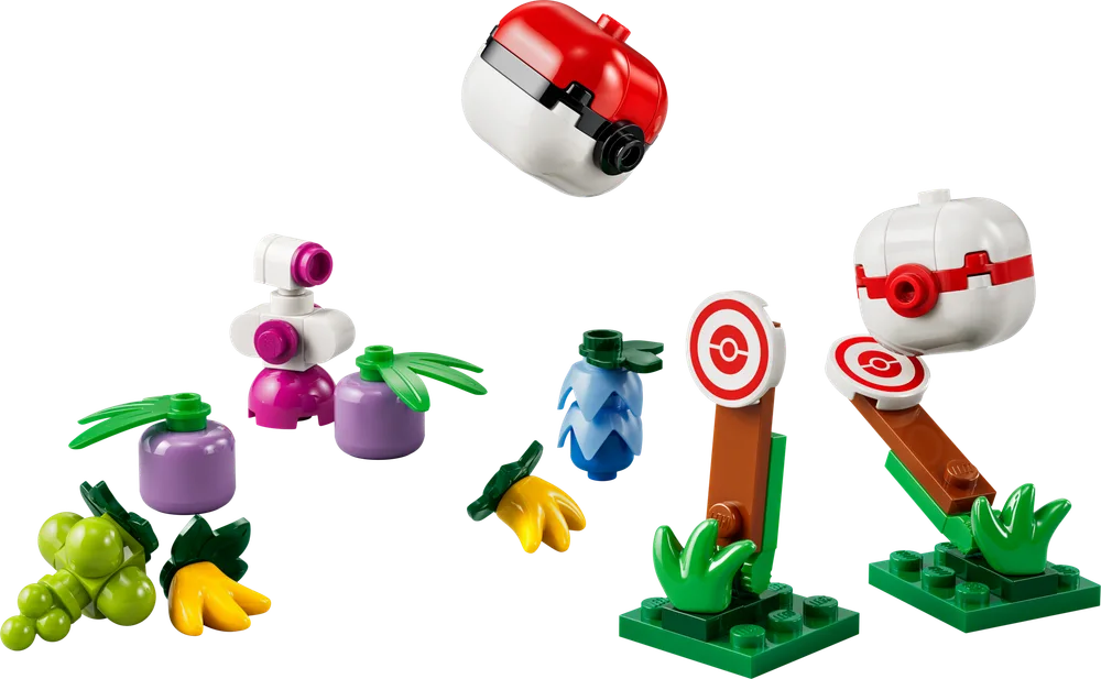 A collection of small LEGO builds on a white background, including a red and white Poké Ball, a blue and white Great Ball, target stands, and various fruit-like items in green, yellow, purple, and blue.