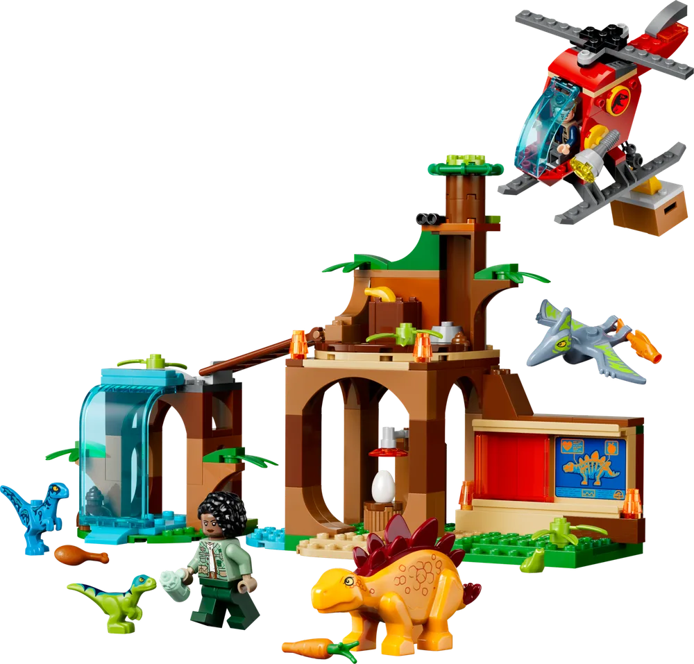 A complete LEGO Jurassic World 77981 set featuring a treehouse, waterfall, red helicopter, and various dinosaurs.