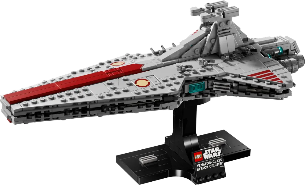 A LEGO Star Wars Venator-Class Attack Cruiser™ model, light gray with a dark red stripe, displayed on a black stand against a white background.