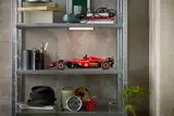 Lego Ferrari SF-24 F1 car on shelf.