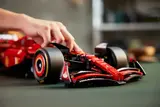 Hand adjusting Lego Ferrari SF-24 F1 car.