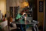 Builder with GT40 model at table.