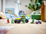 LEGO 4x4 ambulance and rescue scene on a wooden floor.