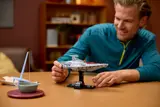 Man holding Acclamator ship.