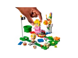 Hand interacts with LEGO Peach figure.