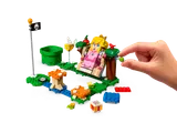 Hand gives fruit to LEGO Peach on swing.