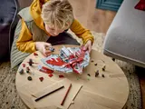 Child building T-6 Jedi Shuttle.