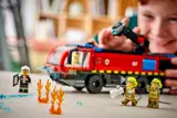 Close-up of child enjoying LEGO fire truck.
