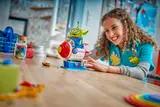 Child playing with LEGO Alien rocket.
