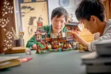 Father and son building the LEGO inn.