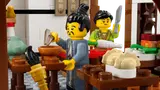 Minifigures cooking in the inn kitchen.