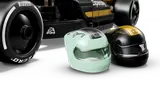 APXGP race car driver helmets and tire close-up.