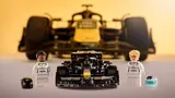 APXGP LEGO car and minifigures, F1 car background.