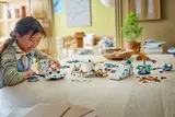 Child playing with LEGO Arctic models.