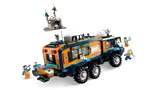 Arctic Explorer Truck, rear view, with snowmobile and cave.