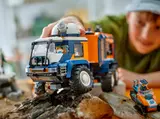 Child plays with front of Arctic truck.