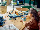 Child playing with modular ship.