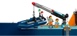 Crane lowering dinghy.