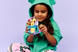 Child playing with Ariel's Palace.
