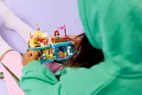 Child playing with LEGO set.