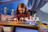 Girl arranging figures on the boat.