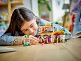 Child playing with Asha's Cottage.