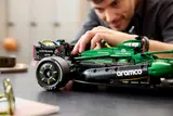 Man attaching side panel to F1® car.