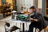 Man holding completed F1® car.