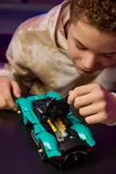 Boy opening car's engine.