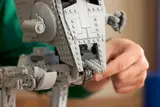 Hand adjusting LEGO AT-ST cannons.
