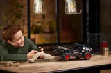 Child playing with Audi RS Q e-tron.