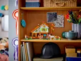 Horse stable set displayed on a shelf.