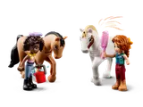 Minifigures grooming horses.