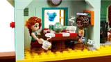 Minifigures enjoying tea in the stable's kitchen.