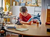 Child playing with Quinjet.