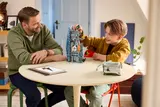 Father and son playing with LEGO.