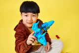 Child shows off Pteranodon.