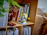 LEGO elephant on bookshelf.