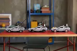 Three LEGO DeLoreans showing movie variants.