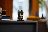 Black Batman on shelf.