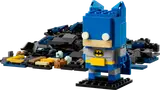 Blue Batman figure with parts pile.