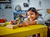 Child playing with Batman Mech.