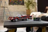 Batmobile on a coffee table.