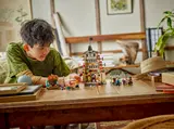 Child playing with LEGO Arlong Park.