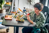 Child playing with Ninjago set.